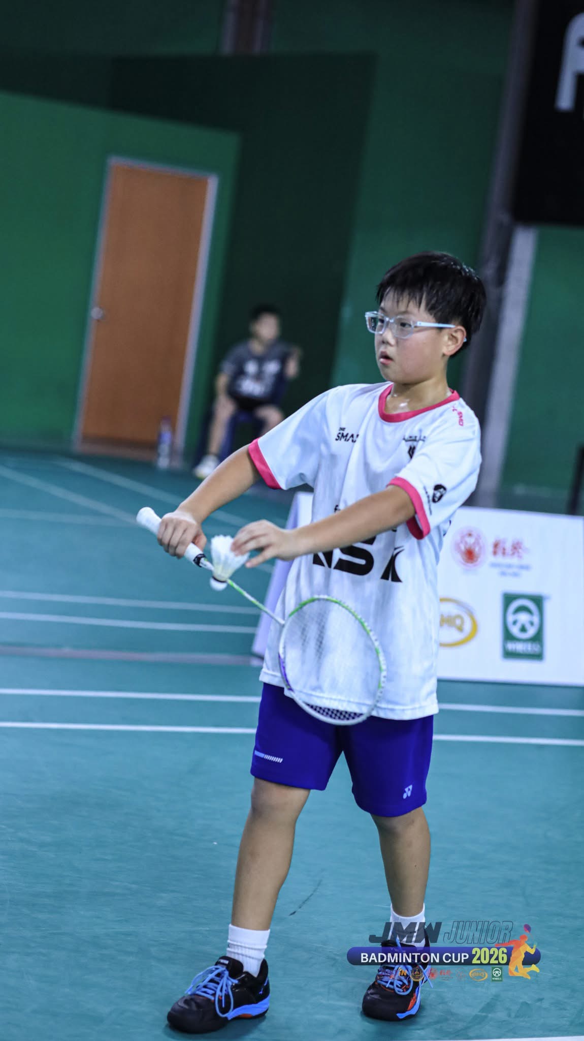 Young KSA player preparing for a rally at the JMW Junior Badminton Cup 2026