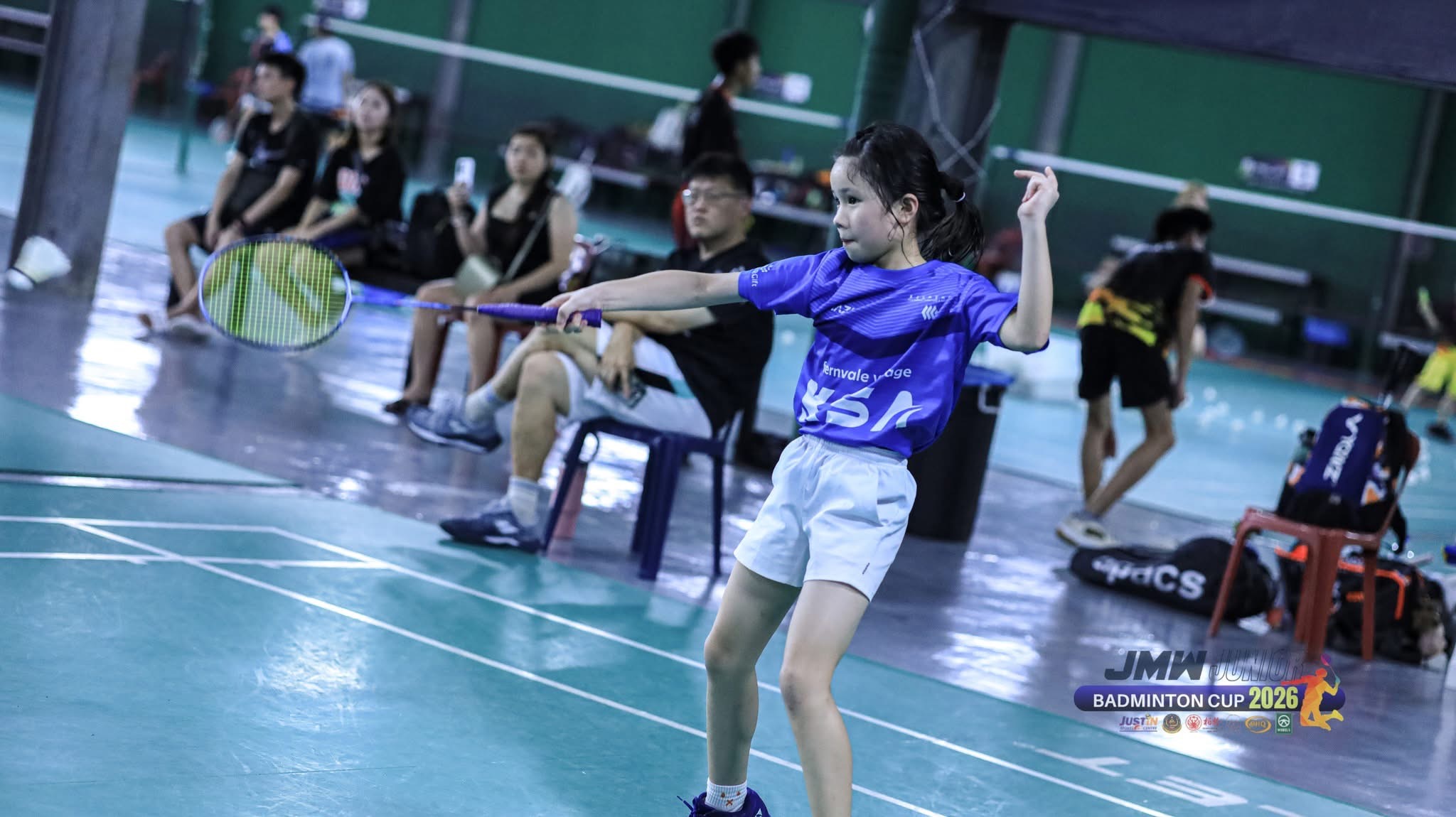 KSA player striking the shuttle at the JMW Junior Badminton Cup 2026